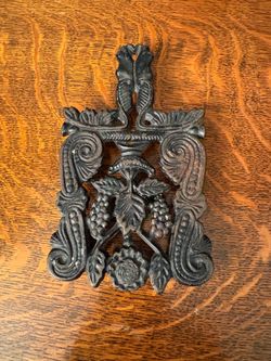 Vintage cast iron grape trivet
