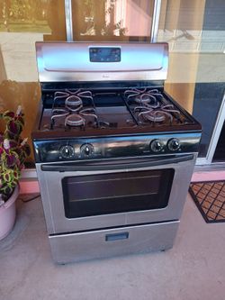 StoveThe stove has a hard button and two burners that light with a match.