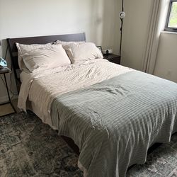 Full size bed frame. Walnut and black metal mattress included if desired