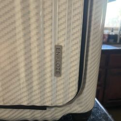 ENKLOZE hard‑shell carry‑on suitcase 
