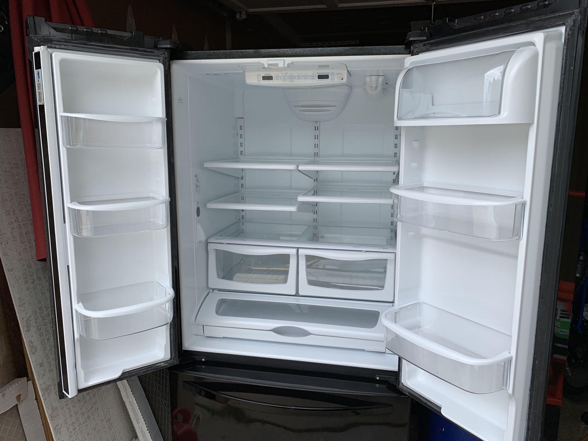 Black French Door Fridge with water and ice