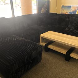 Black Sectional With Storage And Pull Out Bed