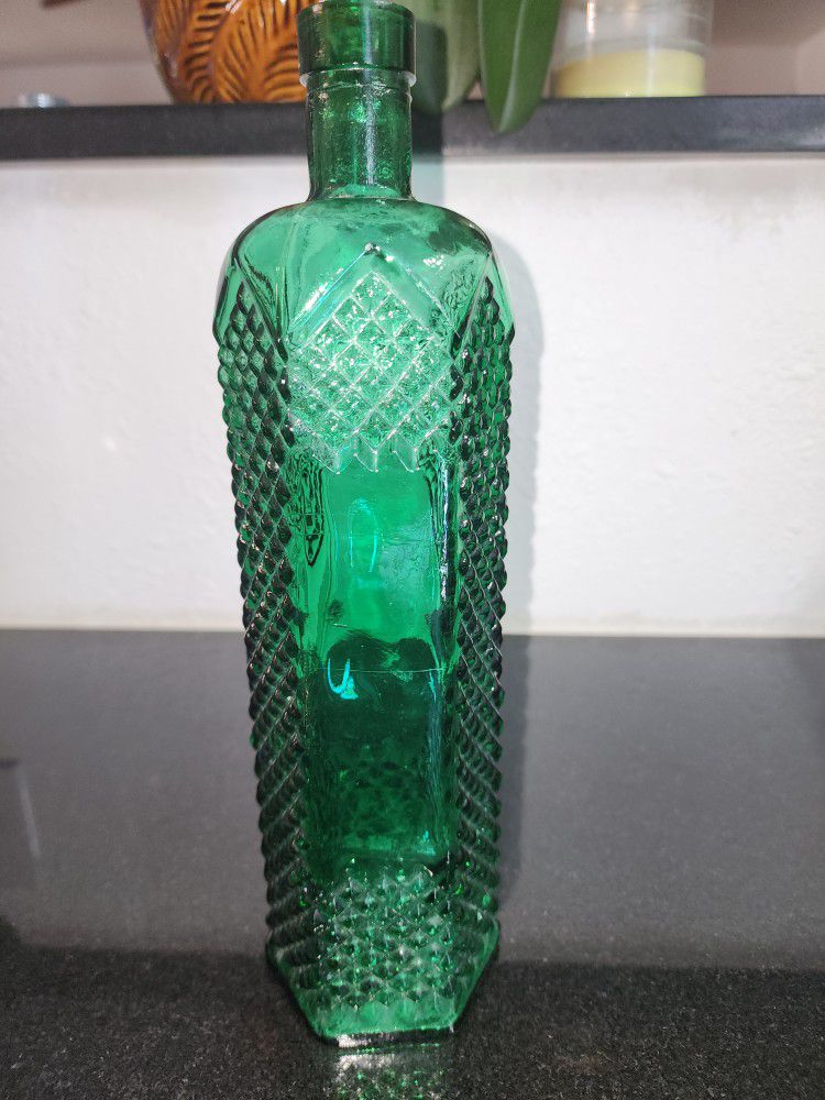Vintage tall glass bottle
