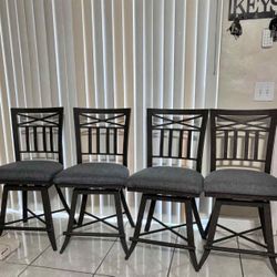 4 Wrought-Iron Swivel Bar Stools