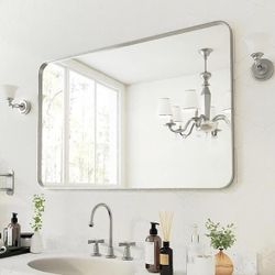 Y56 $45  48 in. W x 32 in. H Rectangular Aluminum Framed Wall Bathroom Vanity Mirror in Silver  With this elegant, framed design, silver framed mirror
