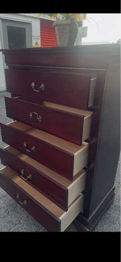 Modern solid wood tall chest with big drawers. Drawer sliding smoothly . Delivery available