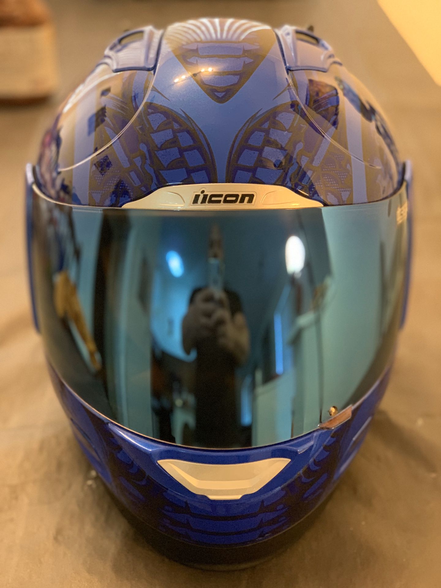 Icon Motorcycle helmet with custom blue mirror visor