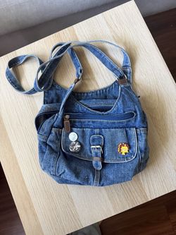 Blue denim crossbody bag with adjustable strap