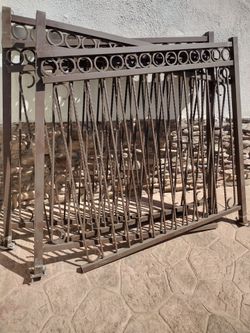 Brown metal fence. Around  20'feet long.  _X. 5 'feet tall. $  250