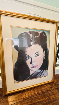 This framed artwork is a color print portrait of Vivien Leigh as Scarlett O'Hara from the 1939 classic film Gone With the Wind.