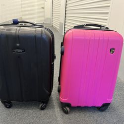 One pink Heys and one black Samsonite suite case