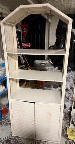 White wicker shelving unit