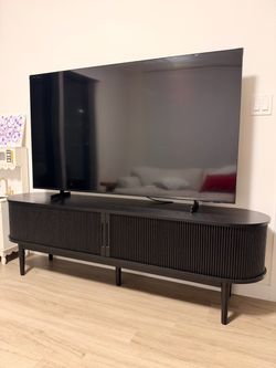 Black Oval TV Stand with Ribbed Doors