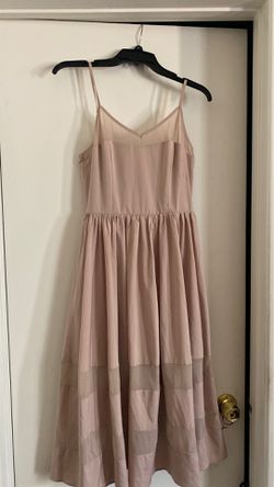 Fore blush color dress.