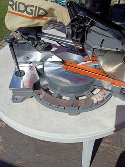 For Sale a used 15A RIDGID 12 in. Dual Bevel Sliding Miter Saw. Model R4222 in Good working condition