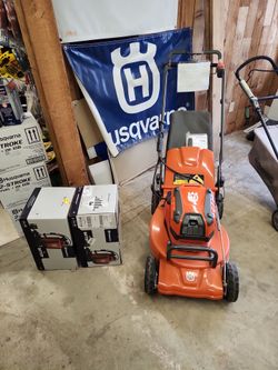 Husqvarna commercial battery lawnmower with 2 31amp batteries