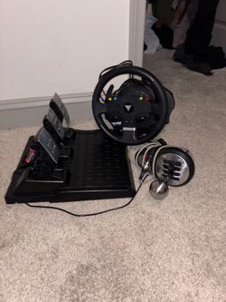 Thrustmaster TMX Force Feedback racing wheel, includes the steering wheel unit, a pedal set, and an external shifter.