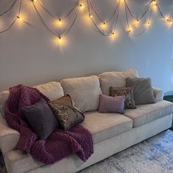 Couch with pillows and blanket