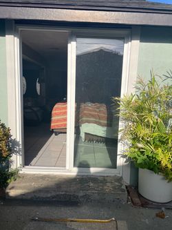 White Framed White Double-Pane Sliding Glass Patio Door
