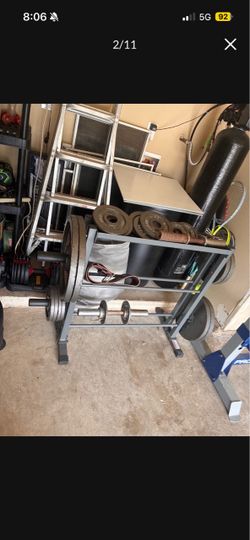 Steel weight plates- 285 pounds and weight rack