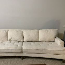 Long Curved Couch And Pillows