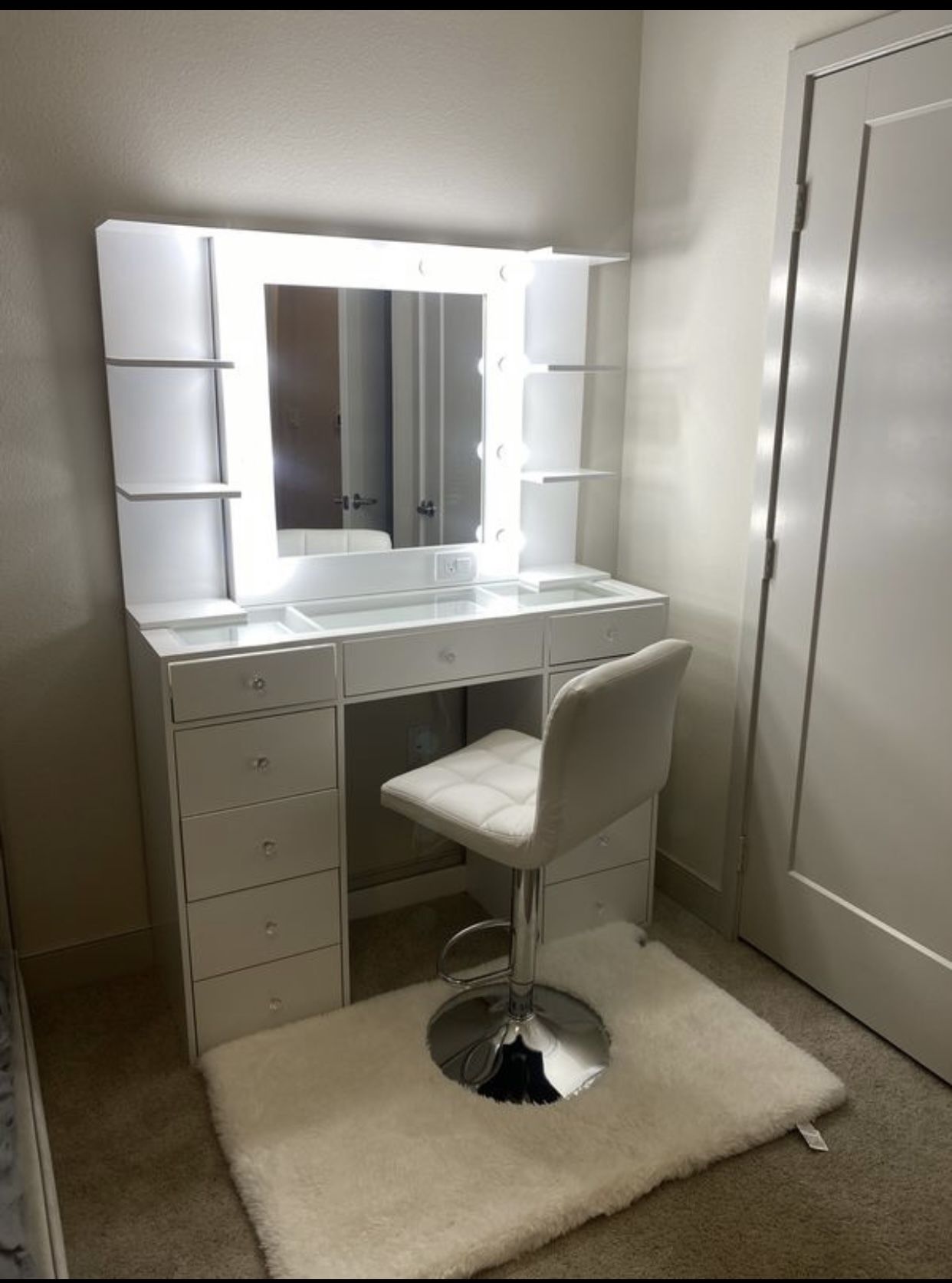 Vanity mirror and desk with 11 drawers and clear glass top and diamond knobs
