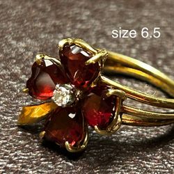 Semi Antique garnet ring size 6.5 with center diamond chip