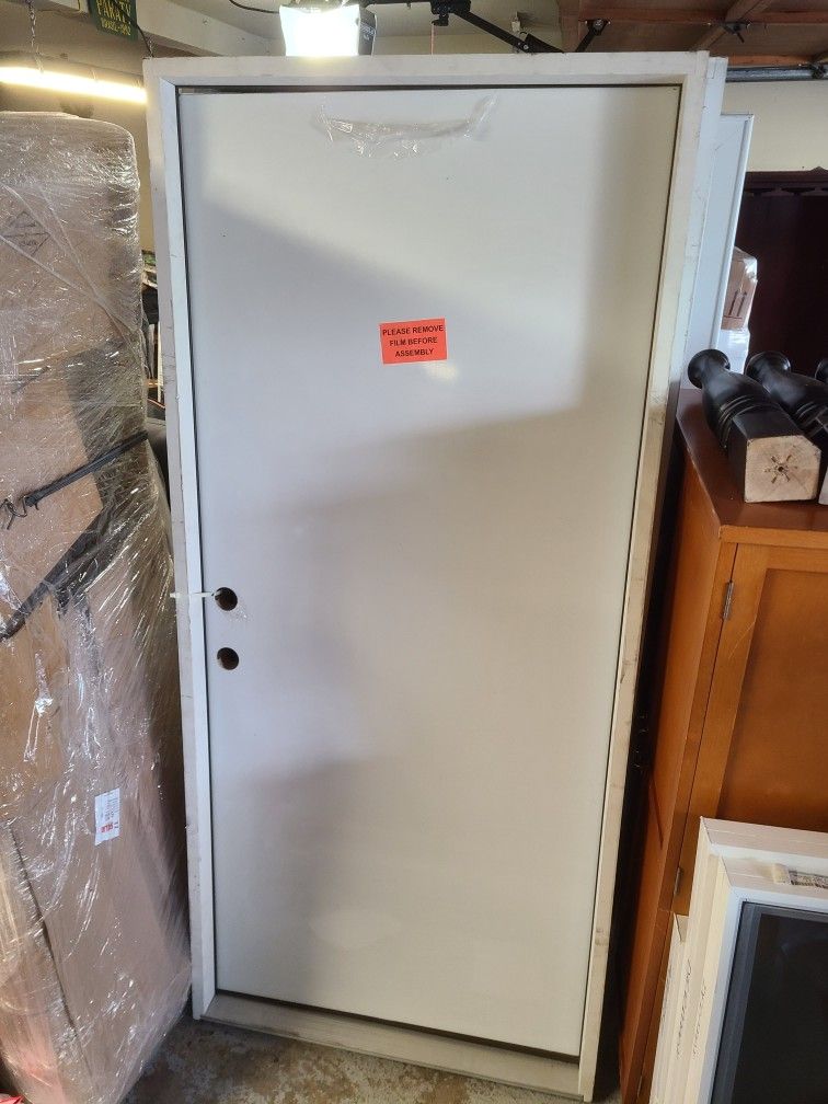Exterior Steel Flat Door with Frame. New, never installed, and right swing
