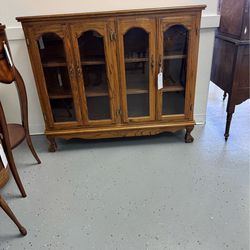 Cabinet 4 Doors.  glass framed in wood.