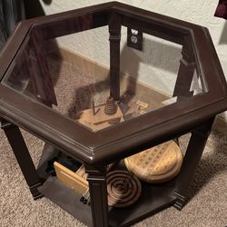Octagonal glass top side table with wood toys