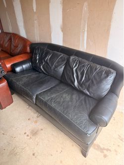 Black leather love seat