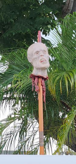 Severed heads on a stick