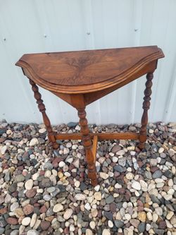 Antique demi-lune / half-moon wood table with spindle legs and scalloped edge