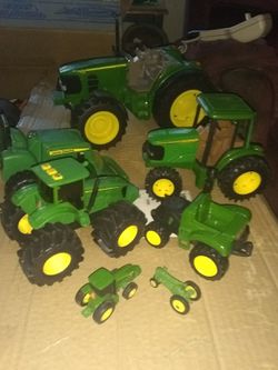 7 different John Deere TRACTOrs