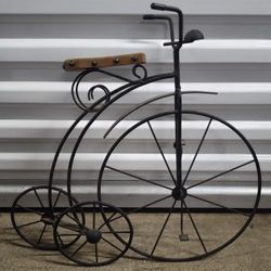 Unique vintage metal tricic wall hanging black Iron frame with wood seat

