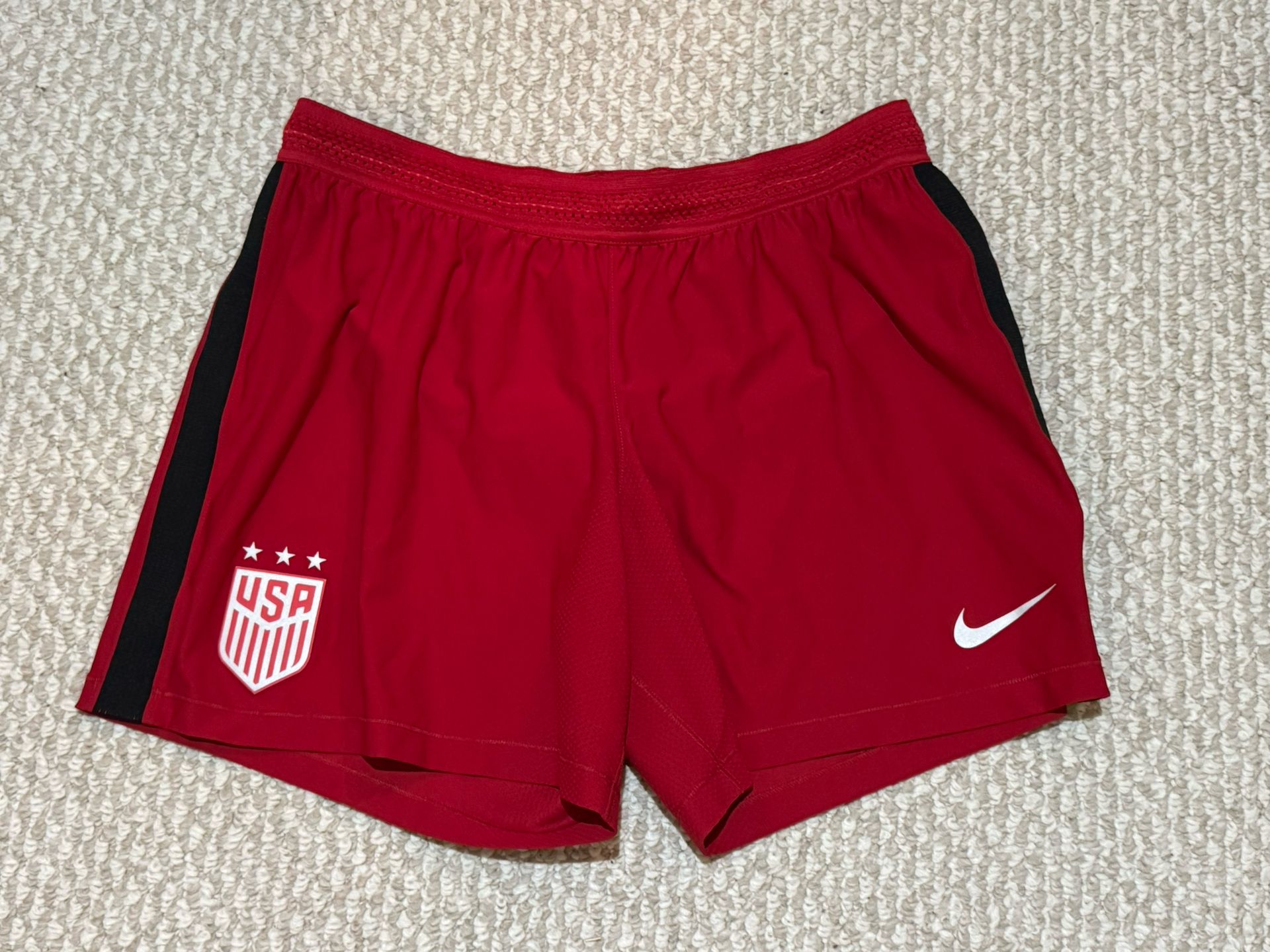 NWOT Woman’s Red Nike Running Shorts Lg. 