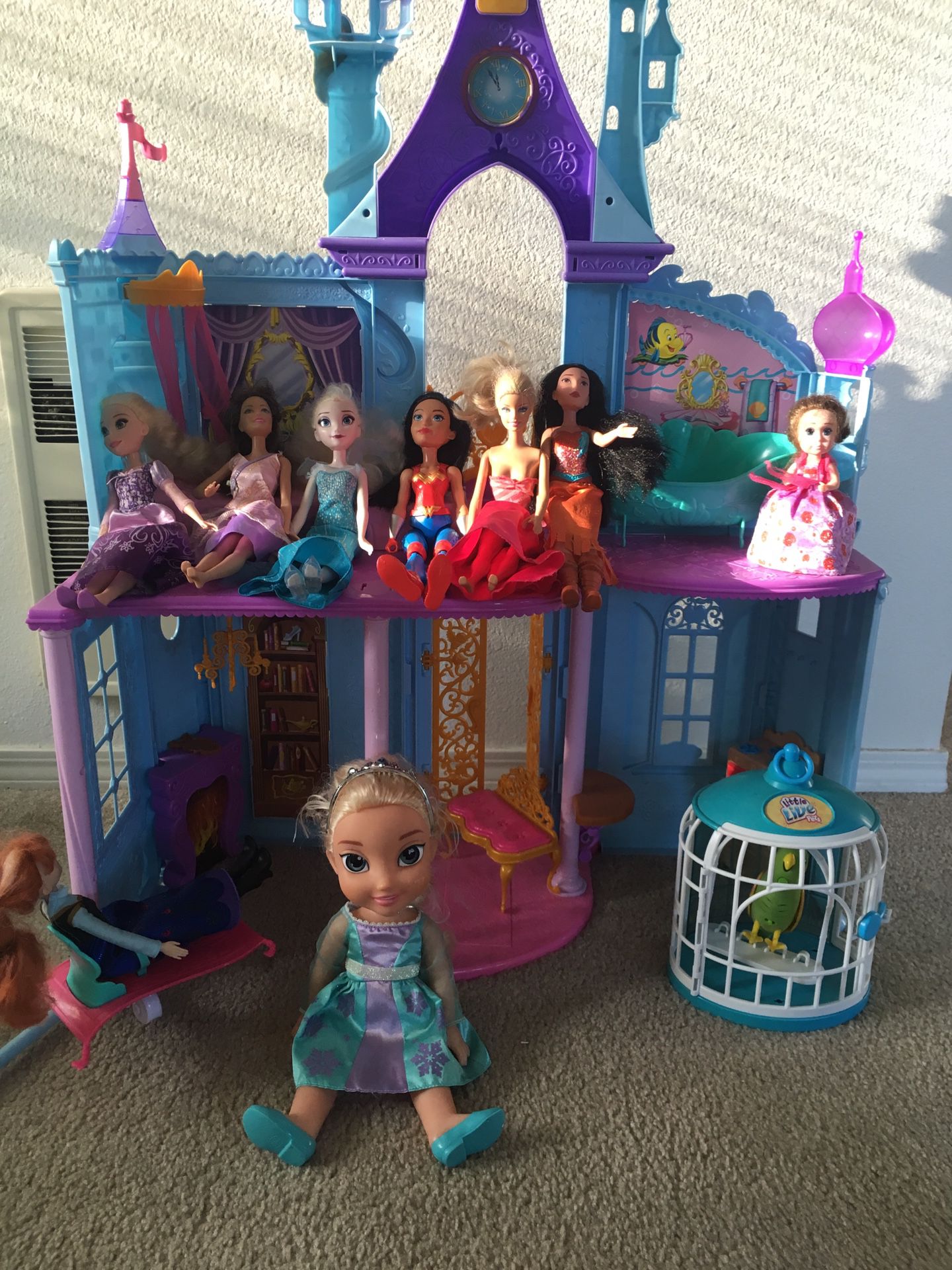 Princess doll house with dolls ( showing in the pics) and other toys ( parrot, Elsa doll, tinker bell and 2 board games and one puzzle all in $10