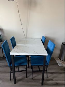 White Modern Dining Table and 4 Blue Chairs