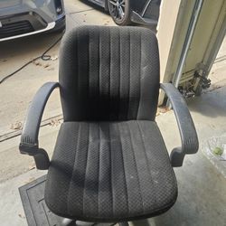 Comfortable black office  chair with adjustable height. 