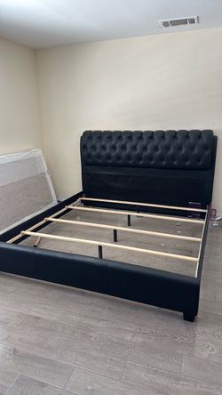 Black king size bed frame with mattress