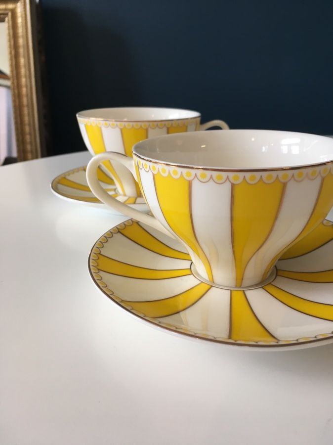 Pair Meritage yellow white striped tea cup and saucer