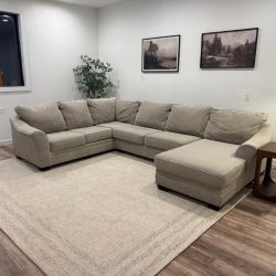 Beige sectional couch delivery available