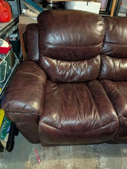 Burgundy electric reclining sofa