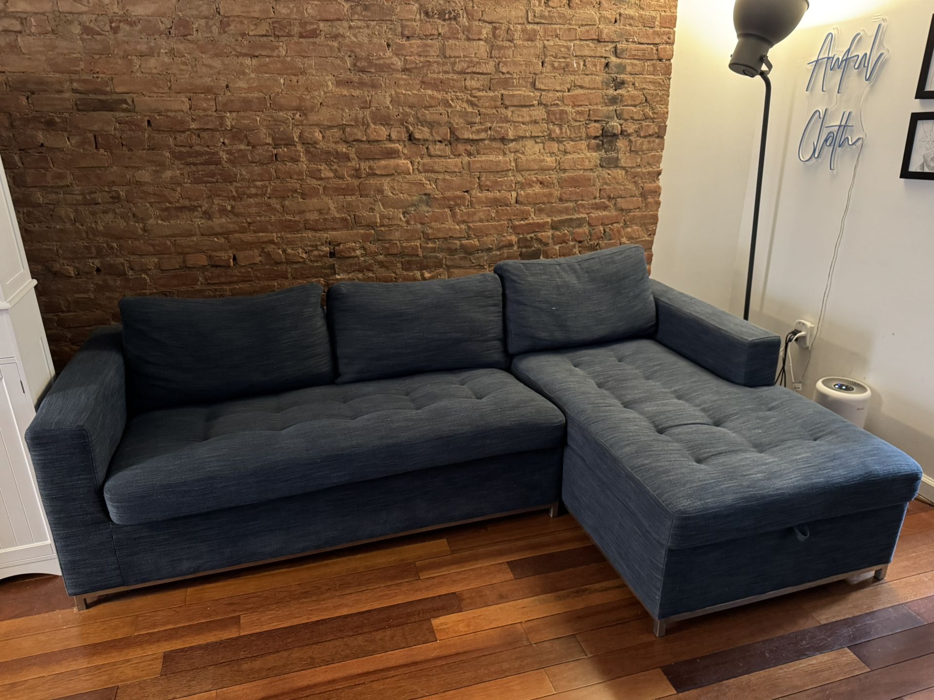 L-Shaped Couch with Pull-Out Bed & Storage – Great Condition!