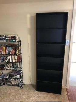 Tall black book shelf