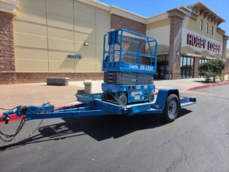 Tilt trailer and genie lift