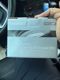 a Tamron 16-300mm f/3.5-6.3 Di II VC PZD Macro zoom lens