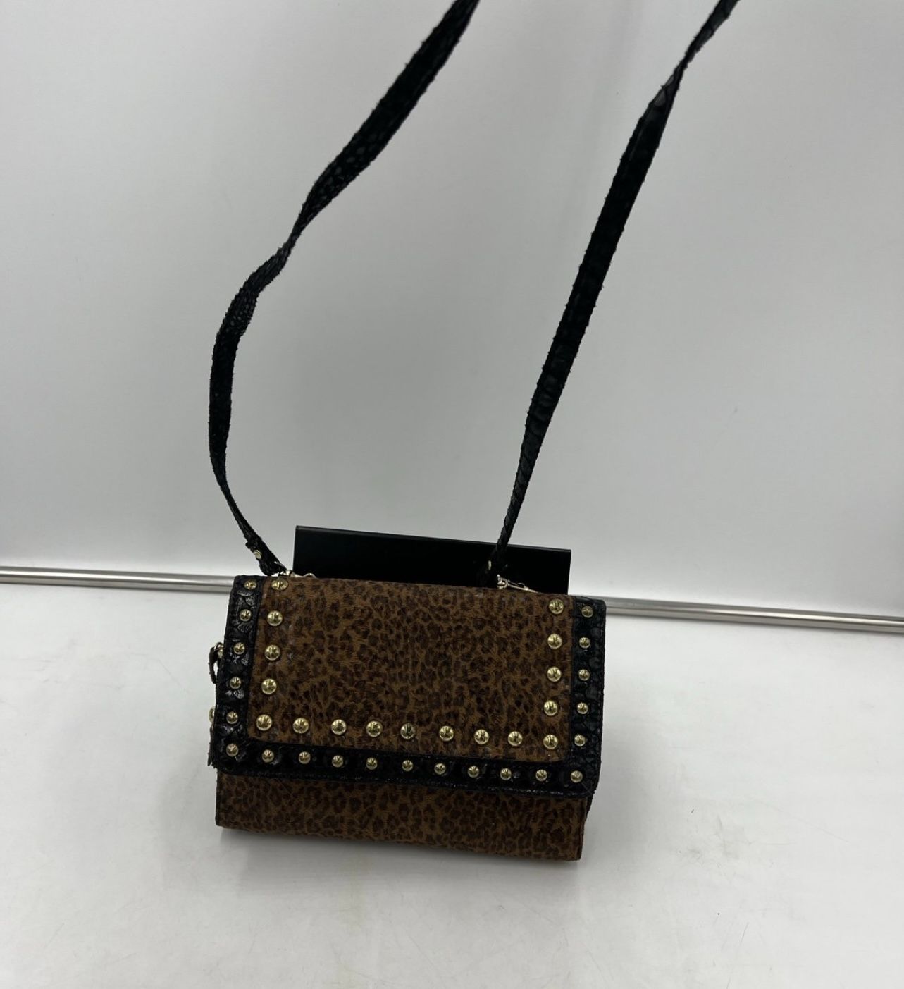 Women’s cheetah printed crossbody bag with gold embellished detail