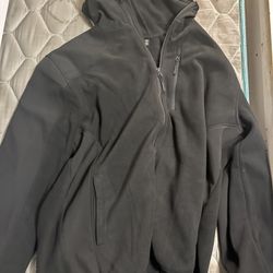 black Reebok zip-up fleece jacket
