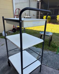 Last chance IKEA cart metal with plastic shelves, top tray, wheels on one side